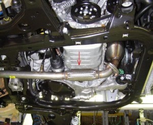 car production line - exhaust connector fitted 
